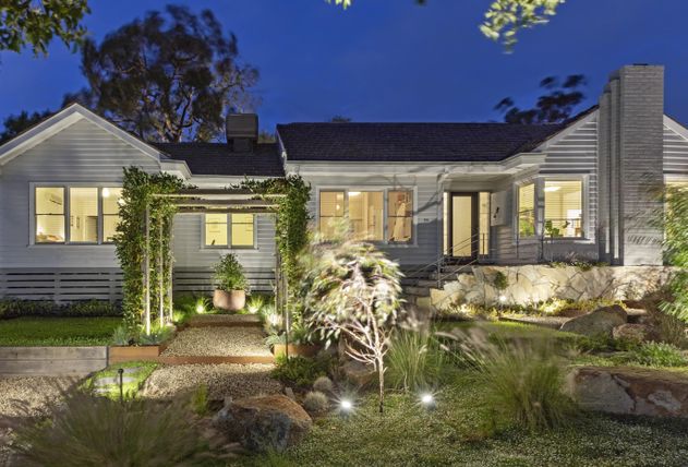 Arbours with vine in garden path