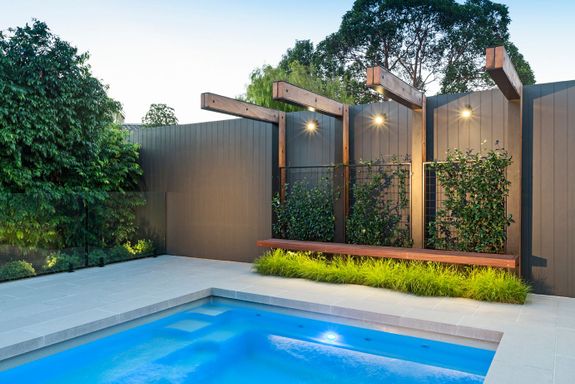 swimming pool with bench seat and overhead